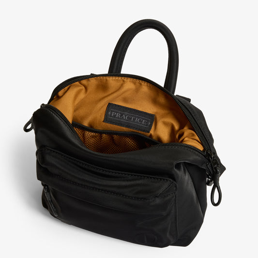 Practice Karma Mini Crossbody bag in Eclipse black color interior shot tan lining material
