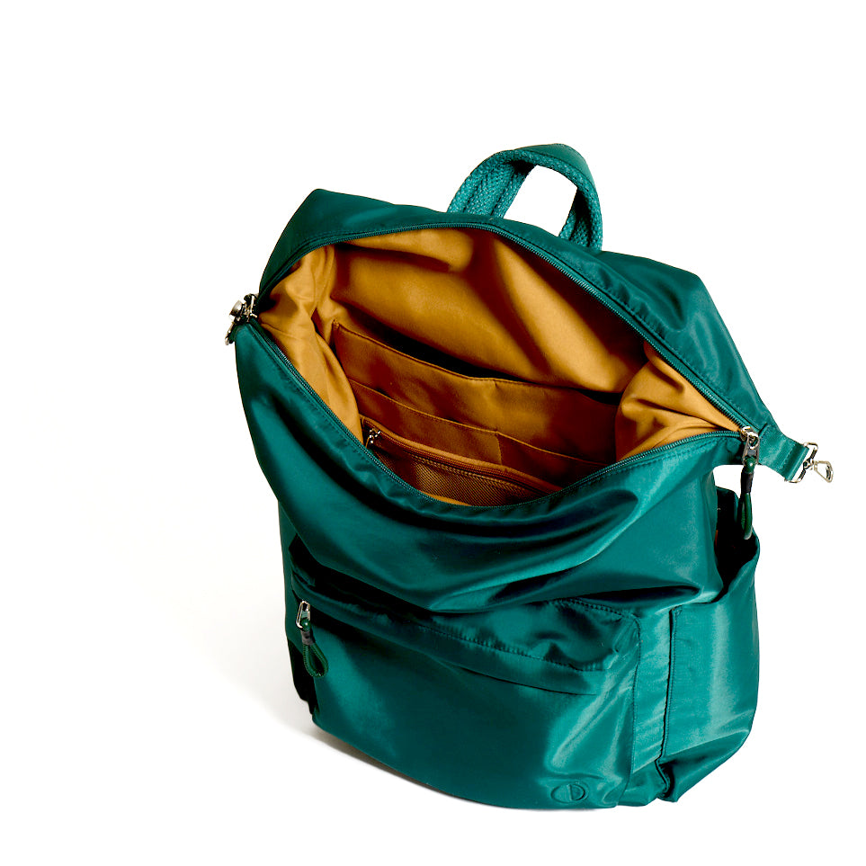 Practice The Karma Backpack in Forest green color interior of bag tan lining material