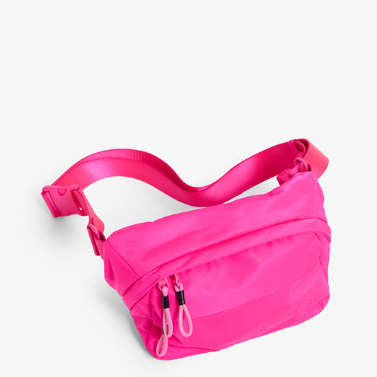 Practice Phase Sling Pack belt bag in Dragonfruit hot pink color