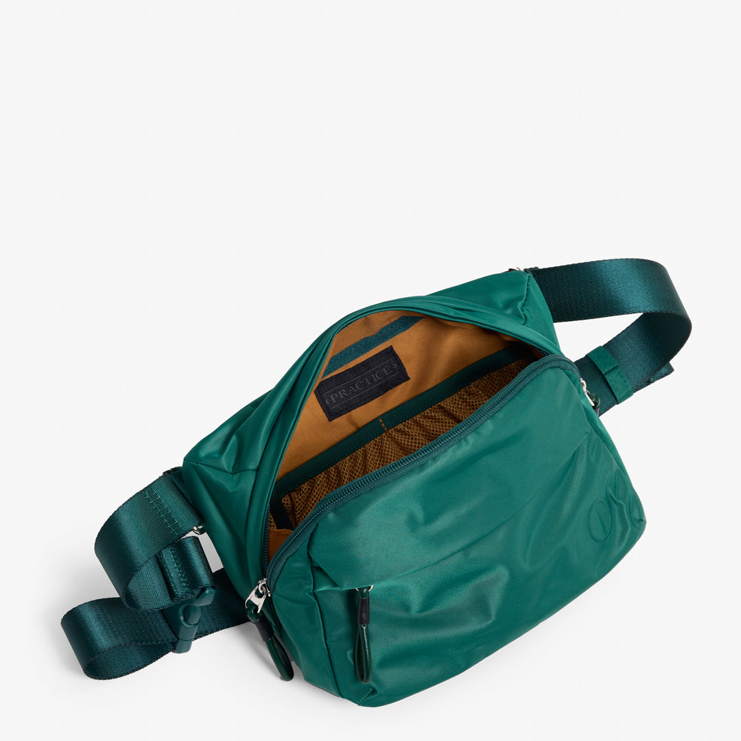 Practice Phase Sling Pack belt bag in Forest green color interior of bag tan lining material