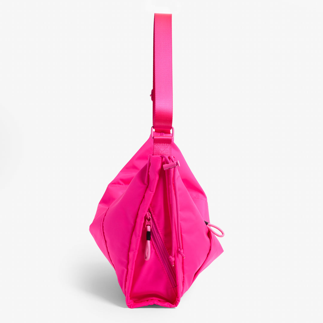 Practice Demilune Shoulder Sling bag in Dragonfruit hot pink color side view