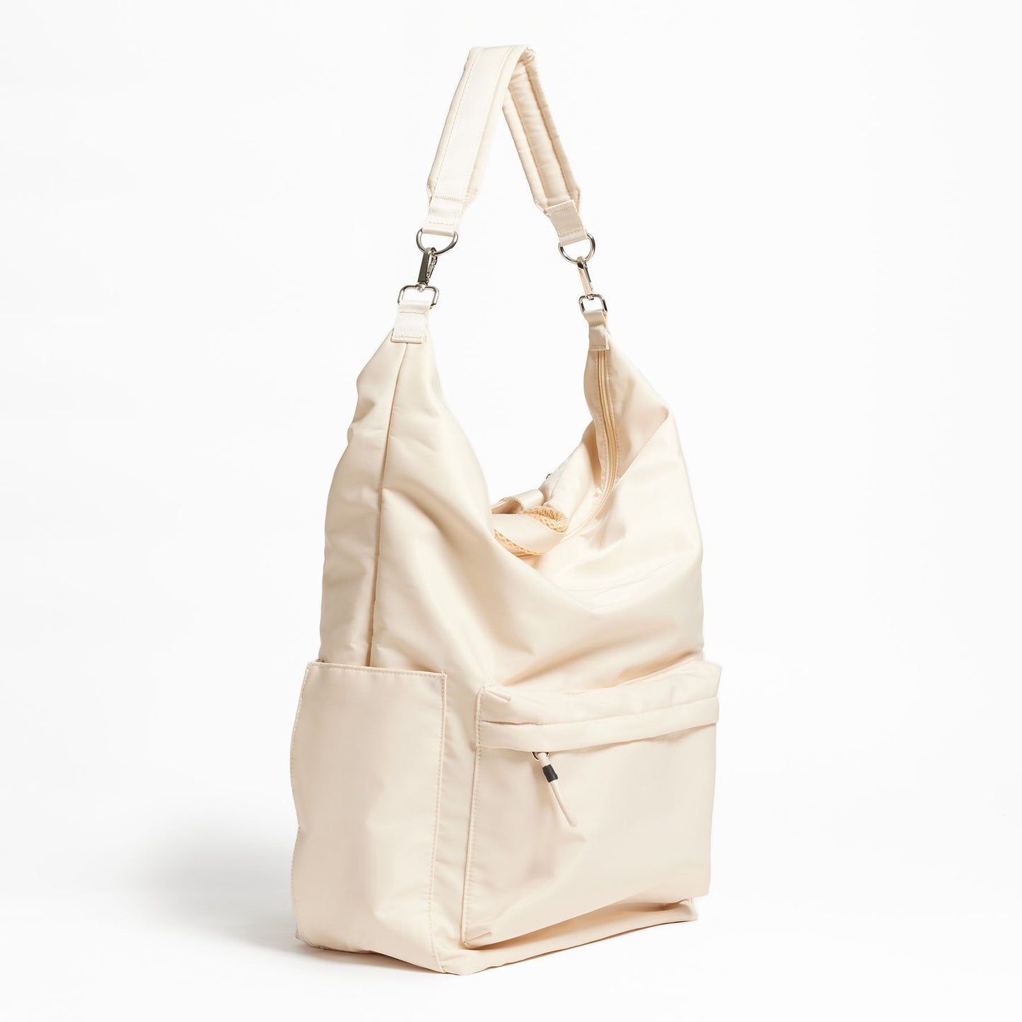 Karma Convertible Backpack in Tofu displayed as a shoulder bag