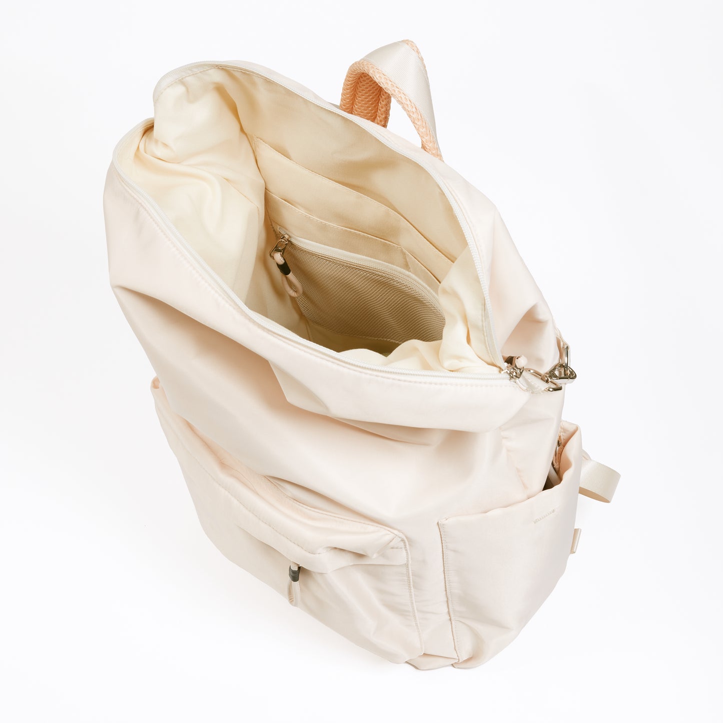 Karma Tofu Backpack with top zipper open showing ivory interior and multiple interior pockets