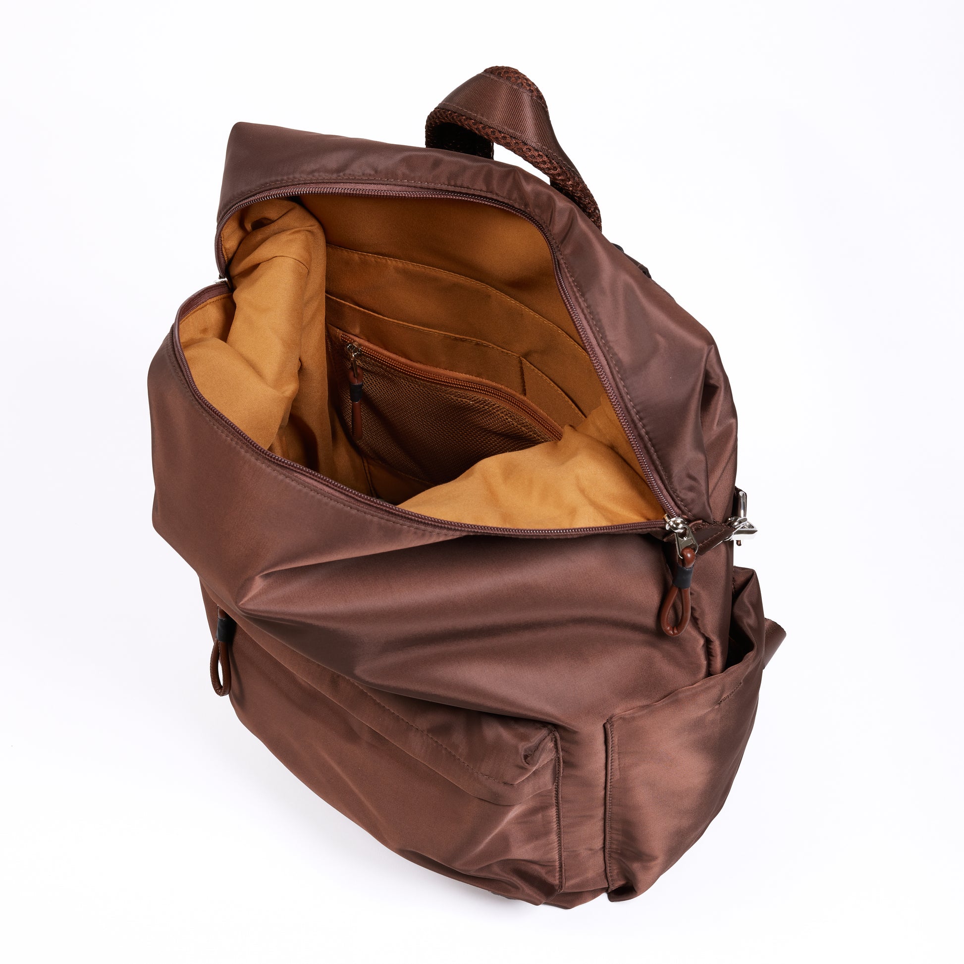 Top inside view of the Karma Backpack in Mushroom Brown Nylon. Backpack has a top handle and a convertible strap to carry your backpack as a tote for easy grab and go!