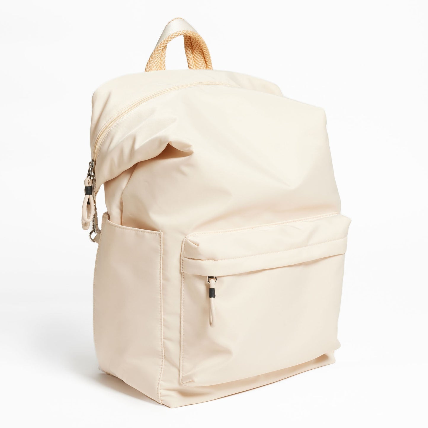 Karma Convertible Backpack in Tofu, front view of large front pocket and shoulder strap folded down